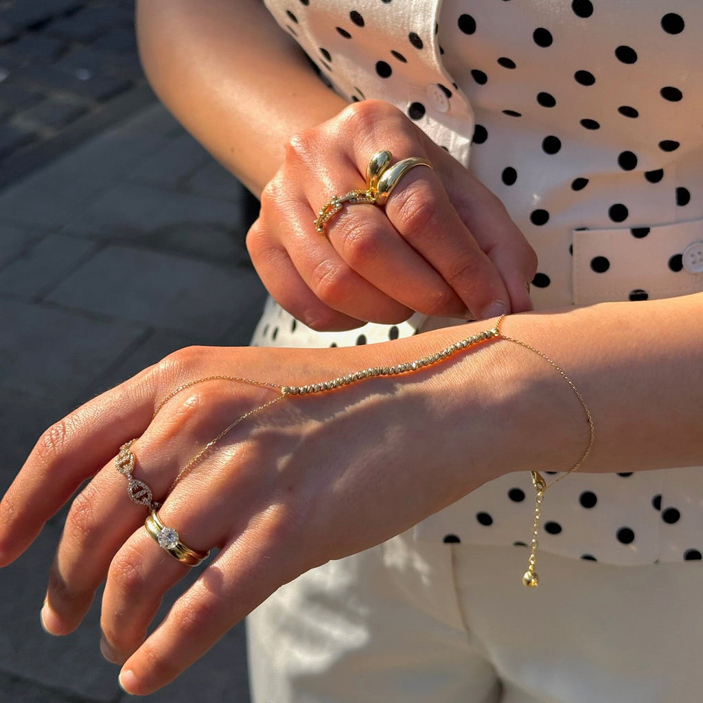 Dorika Handkette-14 Karat