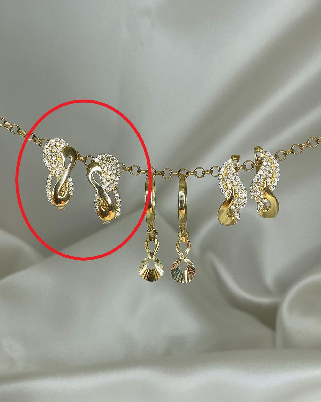 Gold-Ohrringe im Swing-Design in ver. Varianten