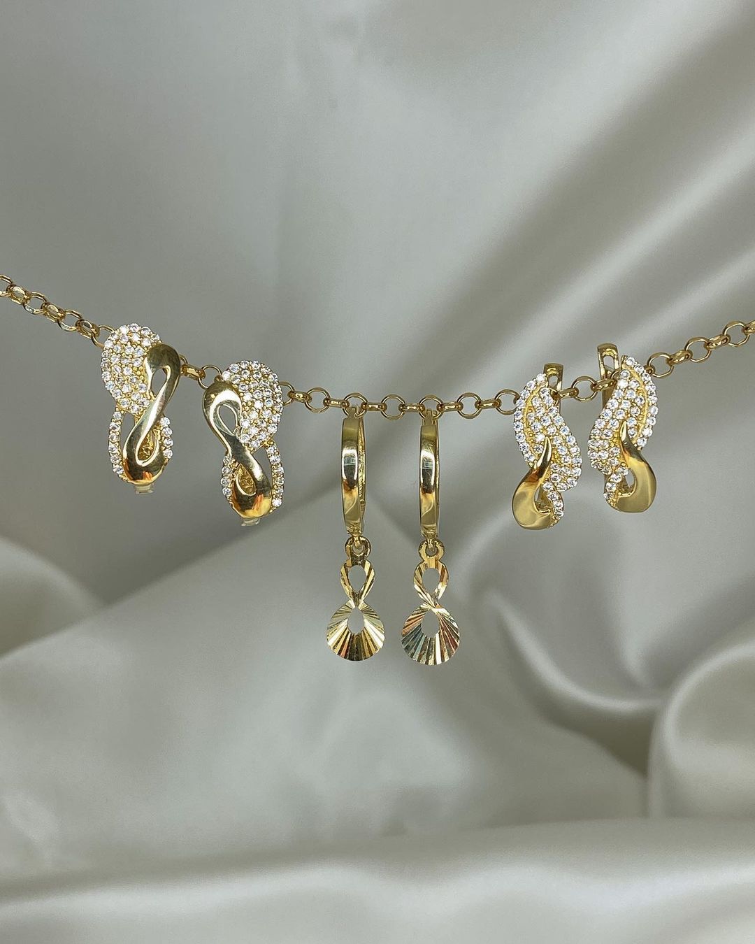 Gold-Ohrringe im Swing-Design in ver. Varianten